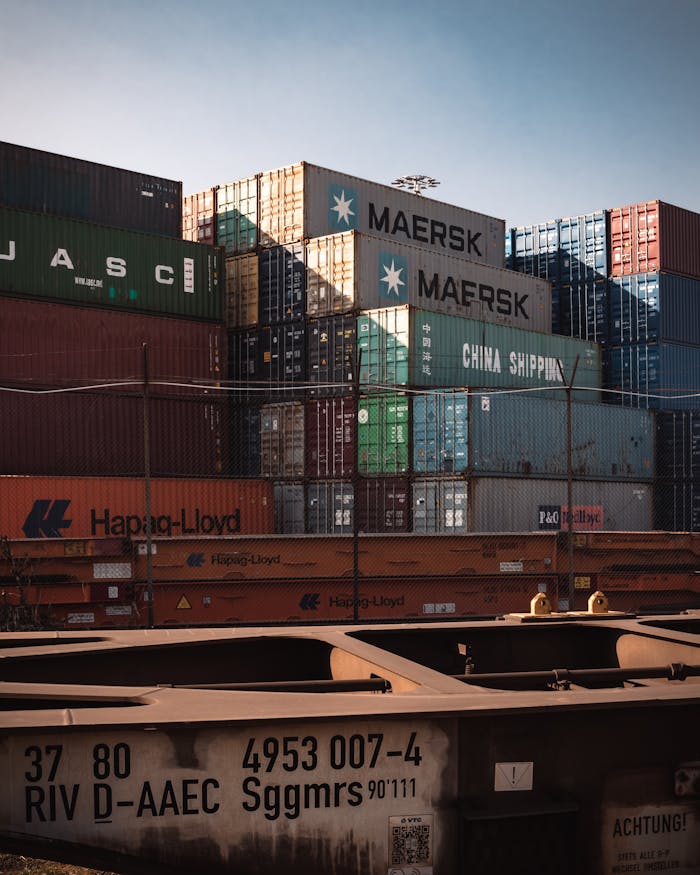 Crafting Captivating Headlines: Your awesome post title goes here A view of colorful cargo containers stacked at a bustling industrial harbor.